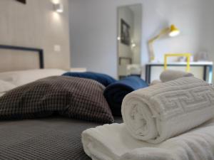 A bed or beds in a room at Central Rooms Matera