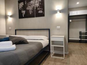 A bed or beds in a room at Central Rooms Matera