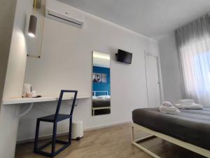 A television and/or entertainment centre at Central Rooms Matera