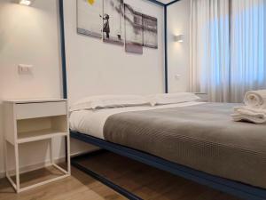A bed or beds in a room at Central Rooms Matera