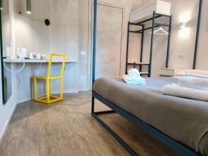 A bed or beds in a room at Central Rooms Matera