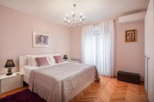 Posteľ alebo postele v izbe v ubytovaní Exclusive Center Apartments