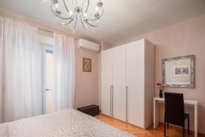 Posteľ alebo postele v izbe v ubytovaní Exclusive Center Apartments