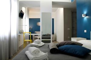 A bed or beds in a room at Central Rooms Matera