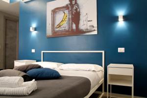 A bed or beds in a room at Central Rooms Matera