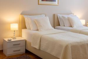 Posteľ alebo postele v izbe v ubytovaní Exclusive Center Apartments