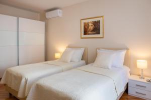 Posteľ alebo postele v izbe v ubytovaní Exclusive Center Apartments