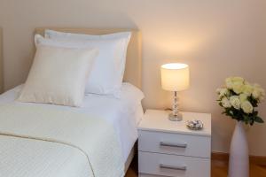 Posteľ alebo postele v izbe v ubytovaní Exclusive Center Apartments