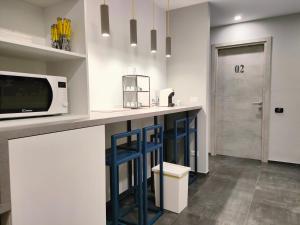 A kitchen or kitchenette at Central Rooms Matera