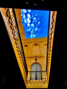 a view of the sky from a building with a window at Gamaleya Boutique Hotel in Cairo