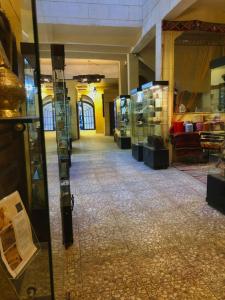 a hallway of a store with glass doors in a building at Gamaleya Boutique Hotel in Cairo