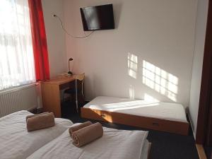 Posteľ alebo postele v izbe v ubytovaní Penzion a Restaurace Bělecký Mlýn