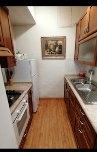 A kitchen or kitchenette at Gelsomino B&B Apartment