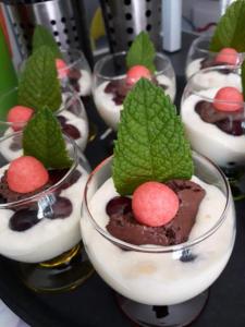 a bunch of dessert dishes with mint leaves on them at Villa suzana in La Suze-sur-Sarthe