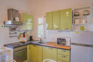 A kitchen or kitchenette at Appartamenti Straccoligno