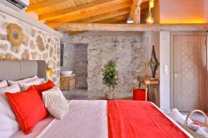 a bedroom with a large bed with red pillows at Flower Hotel Patara in Patara +37 photos