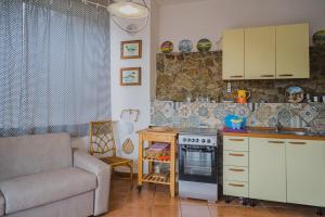 A kitchen or kitchenette at Appartamenti Straccoligno