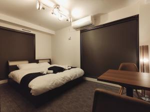 a hotel room with a bed and a table and a dining room at West Japan Kyoto Kiyomizu in Kyoto