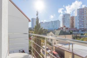 a balcony with a view of a city at Bagira Guest House in Sevastopol