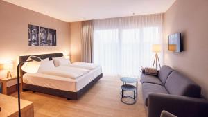 Ein Bett oder Betten in einem Zimmer der Unterkunft Seehotel Maria Laach