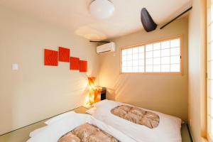 Säng eller sängar i ett rum på West Japan Kyoto Kiyomizu