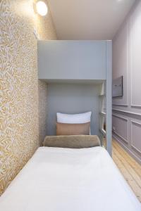 Llit o llits en una habitació de Le Marnix