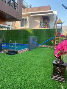 Gallery image of MOUNT RESORTS LONAVALA 5 BHK LUXURIOUS VILLA WITH PRIVATE POOL AND FULL SIZE CRICKET FOOTBALL TURF in Lonavala