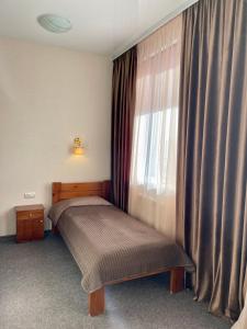 Кровать или кровати в номере Мотель Уют