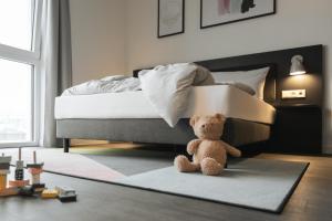 Postel nebo postele na pokoji v ubytování Candlewood Suites Berlin Charlottenburg by IHG
