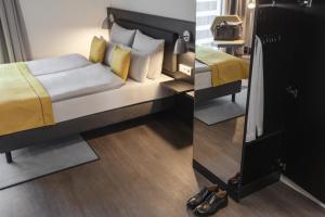 Postel nebo postele na pokoji v ubytování Candlewood Suites Berlin Charlottenburg by IHG