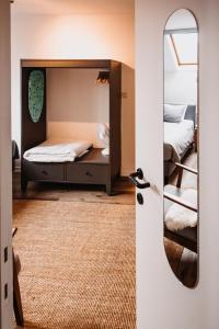 a bedroom with two beds and a mirror at Super central in Brussels in Brussels