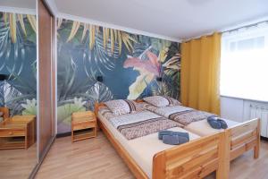 Łóżko lub łóżka w pokoju w obiekcie Apartamenty Częstochowa