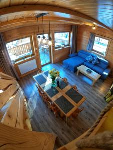 an overhead view of a living room with a blue couch at Chałupy Pod Lipami in Szklarska Poręba