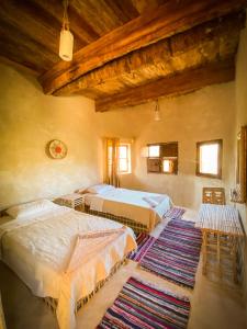 Postel nebo postele na pokoji v ubytování Sleep In Siwa