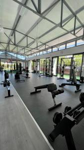 a gym with a lot of exercise equipment in it at 417 The Sandown in Cape Town