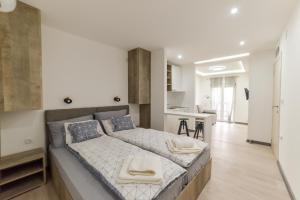 Postel nebo postele na pokoji v ubytování Apartmani Statik SD
