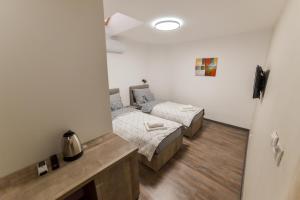 Postel nebo postele na pokoji v ubytování Apartmani Statik SD