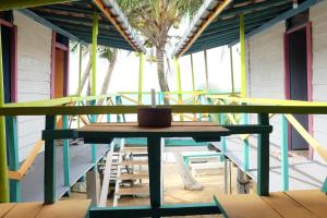 a table on the porch of a house at Ceylon Beach Home in Galle