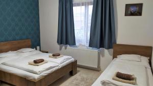 Posteľ alebo postele v izbe v ubytovaní Müezzin Apartman