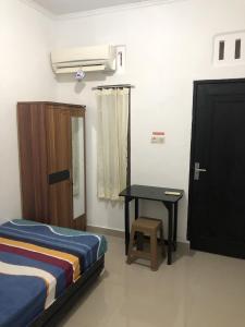 Postel nebo postele na pokoji v ubytování Beverly Residence
