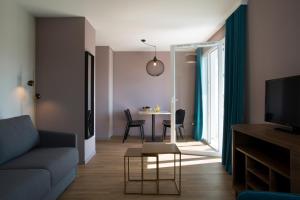 Posezení v ubytování Résidence-Aïga Resort thermal & spa + 21 fotografií