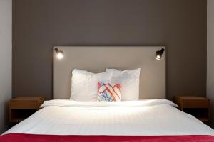 
Säng eller sängar i ett rum på Hotel Bishops Arms Strängnäs
