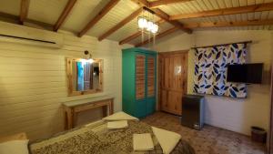 a bedroom with a bed and a tv in a room at Shams Hotel & Dive Centre in Dahab
