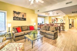 a living room with two couches and a table at Waterfront Golf Course Home with Screened Balcony! in North Myrtle Beach