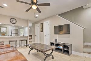 a living room with a couch and a ceiling fan at Fort Walton Beach Townhome Less Than 3 Mi to the Beach! in Fort Walton Beach