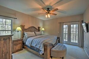 a bedroom with a bed and a ceiling fan at Family-Friendly Lake Lanier Escape on 2 and Acres! in Gainesville