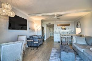 a living room with a couch and a table at Beachfront Clearwater Condo with Community Pool in Clearwater Beach