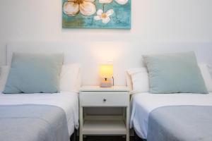 A bed or beds in a room at Costa den Blau
