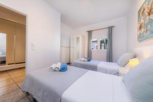 A bed or beds in a room at Costa den Blau