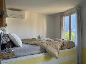A bed or beds in a room at GLI ORTI DELLA CIVERA " Cottagecore" Amazing View